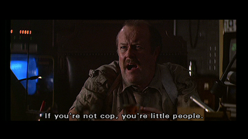 Bryant: Stop where you are! You know the score. If you're not cop, you're little people.